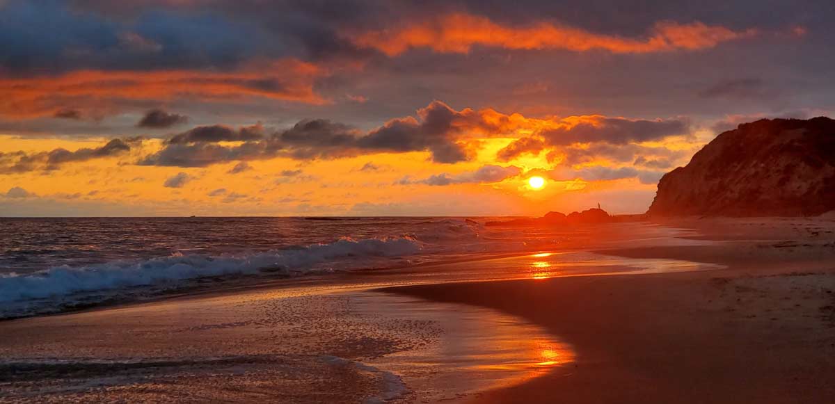 Bright red sunset over the beach