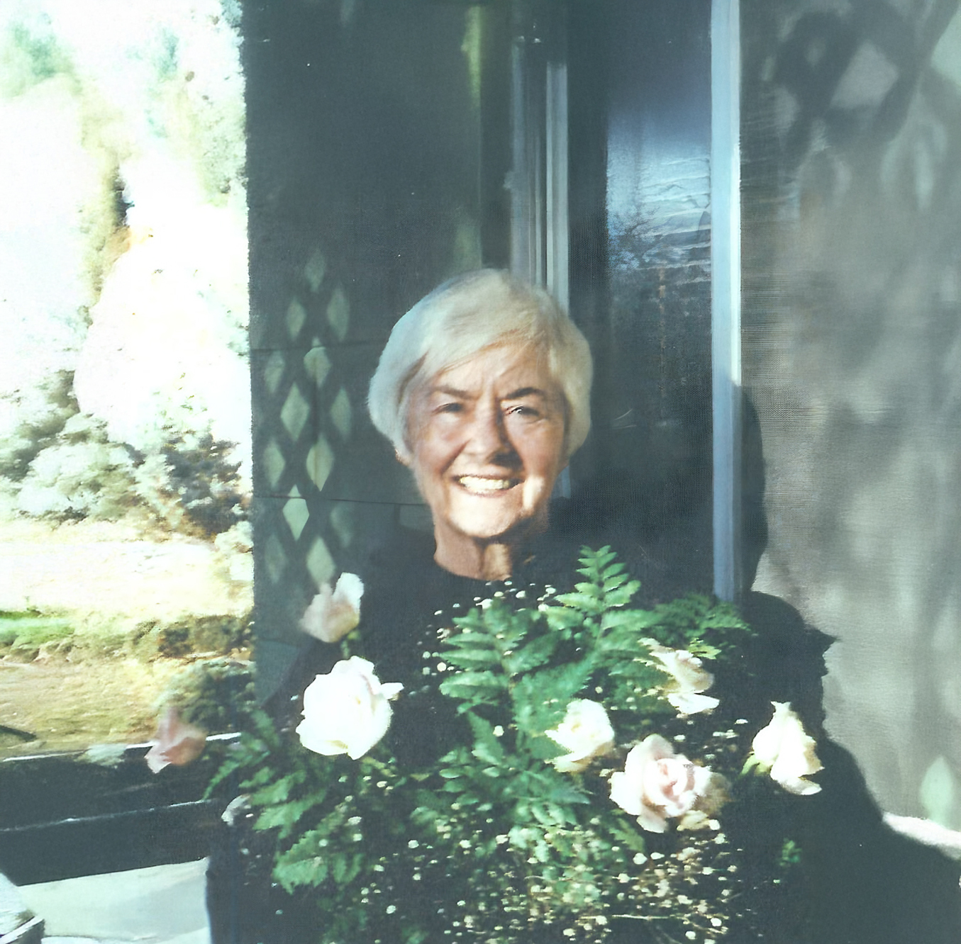 Sister Marie Celeste Fadden Sister Marie Celeste Fadden with a bunch of flowers in front of her.
